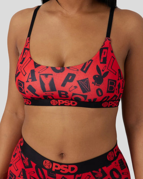 Red bralette with black Playboy bunny logo and text print, black shoulder straps and elastic waistband with PSD branding.