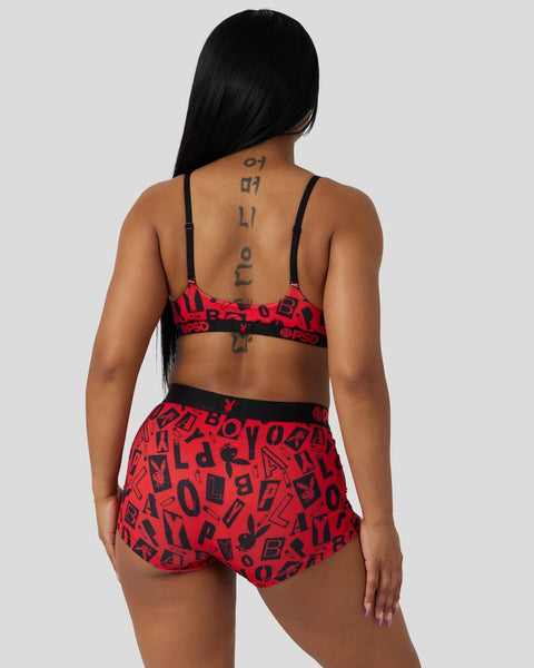Red and black Playboy Anarchy bra and shorts set with all-over logo print, shown from back view on model.