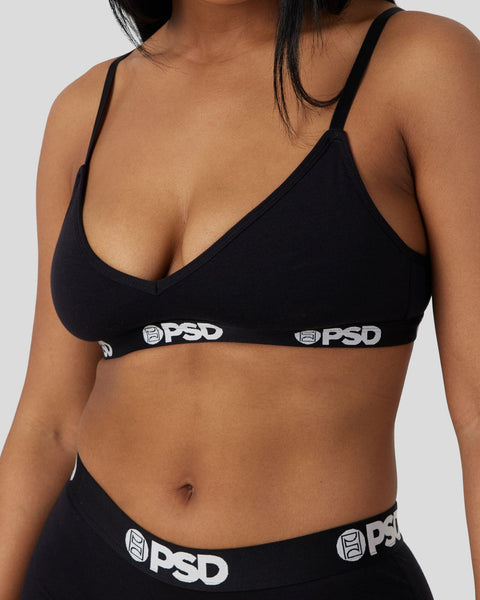 Black modal bralette with thin spaghetti straps and PSD branding on elastic band.