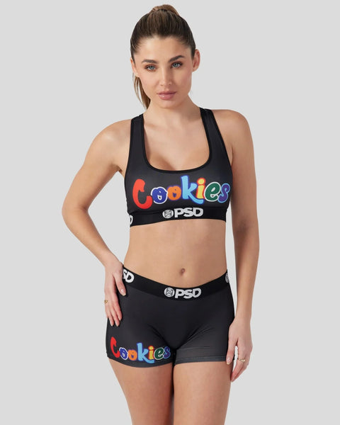 Woman wearing black sports bra and shorts with colorful 