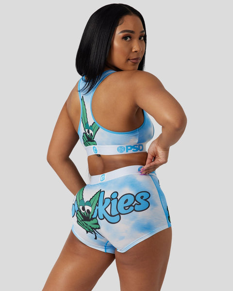 Woman wearing blue and white sports bra and shorts set with 