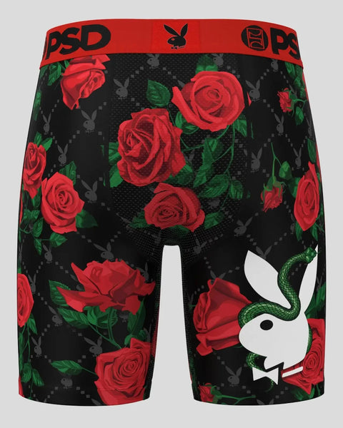 Black shorts with red roses, green leaves, gray Playboy bunnies, red PSD waistband, and white bunny logo with green snake on 