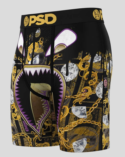 Black PSD boxer briefs with gold ornamental patterns, purple accents, and monster mouth graphic design on front.