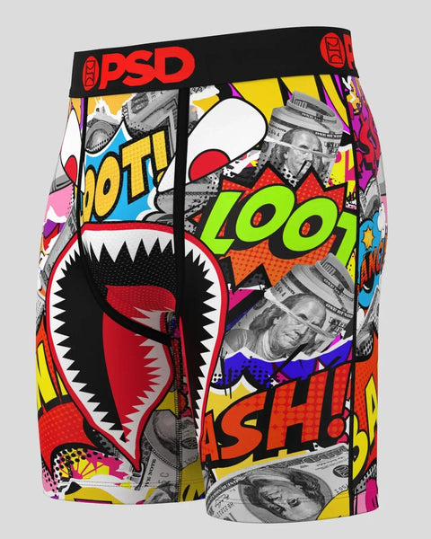 PSD brand shorts with colorful pop art design, shark mouth graphic, money imagery, and black waistband.