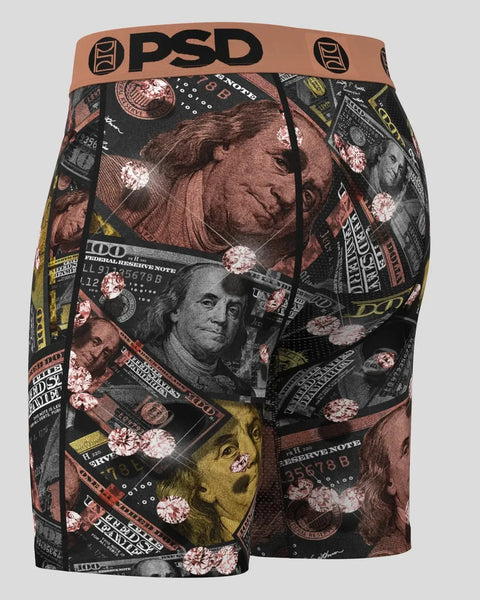 PSD boxer briefs with tan waistband featuring metallic currency portraits and floral patterns on black fabric.