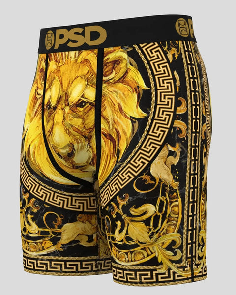 Black and gold shorts with lion head, Greek key pattern, and ornamental designs throughout.