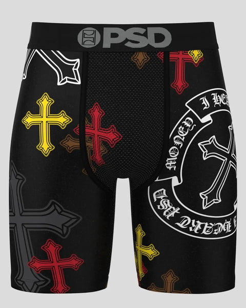 Black PSD shorts with decorative cross designs in red, yellow, and white embroidery across legs and circular graphic on right