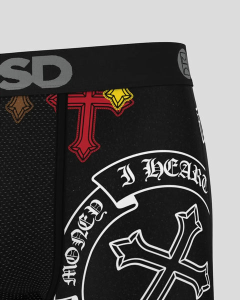 Black underwear waistband with cross symbols in red and yellow, and decorative text on elastic band.