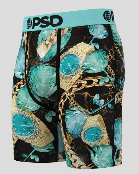 Black boxer shorts with turquoise waistband featuring gold watches, chains, and green leaf pattern throughout.