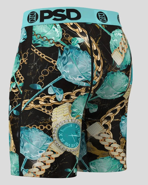 PSD boxer briefs with turquoise ice crystals, gold chains, watches, and diamonds on black background.