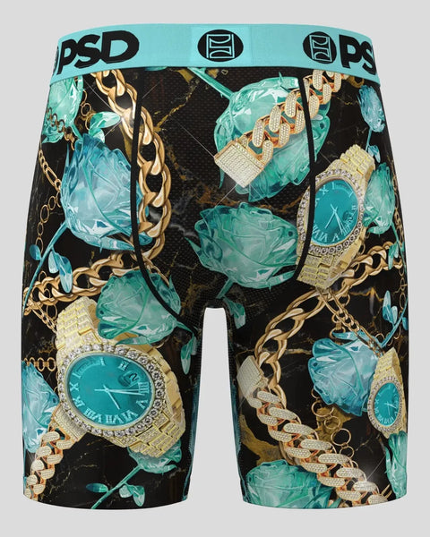 PSD brand boxer shorts with turquoise ice crystals, gold chains, and diamond-encrusted watches on black background.