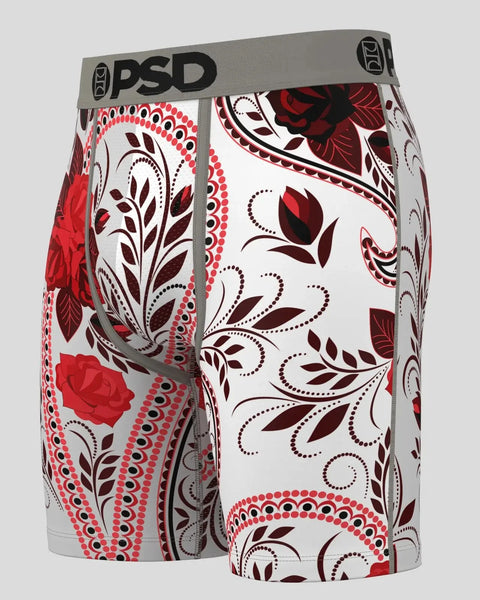 White shorts with red and burgundy paisley and floral print, gray PSD waistband.