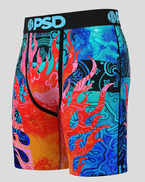PSD brand boxer briefs with colorful flame and paisley patchwork pattern in red, blue, pink, and cyan.