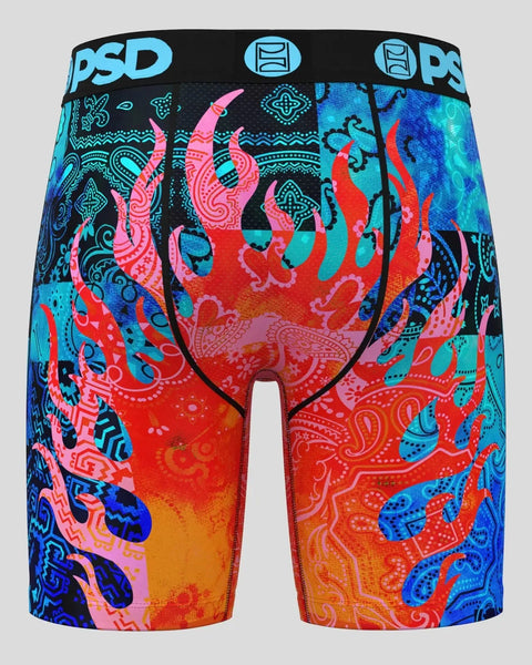 PSD brand shorts with colorful flame and paisley pattern in red, pink, blue, and cyan on black waistband.