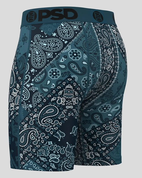 PSD men's boxer briefs in teal with white paisley and geometric pattern throughout.