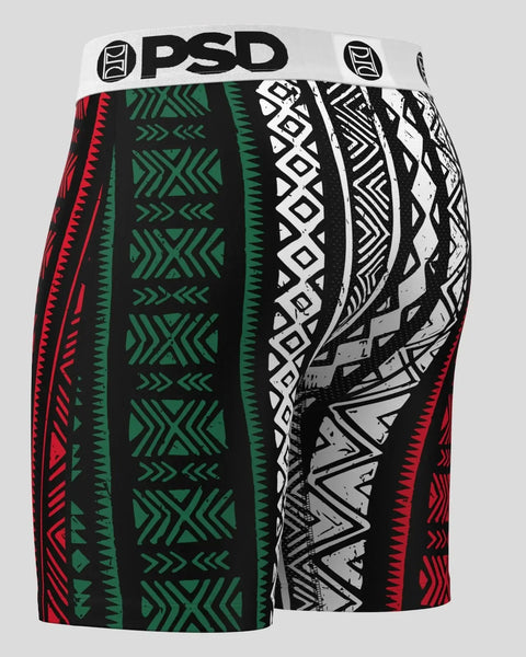 PSD brand shorts with mixed geometric patterns in red, green, white, and black.