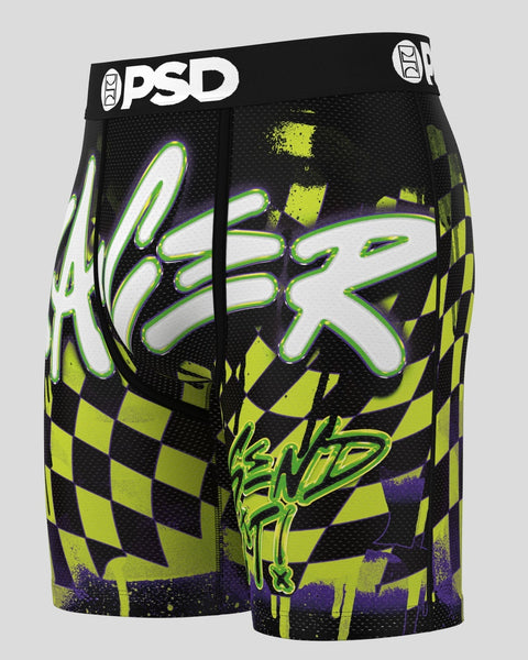 PSD black shorts with neon green and white neon racer graphic, checkered pattern, and purple accents.