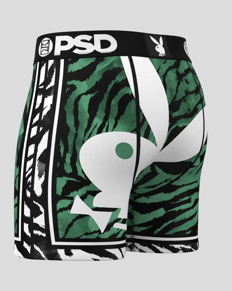 PSD boxer briefs with green and black tiger stripe pattern, white Playboy bunny logo, and black waistband with branding.