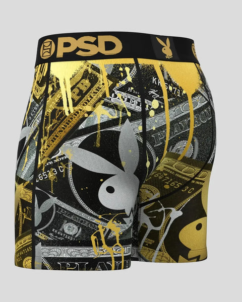 PSD boxer briefs with black waistband featuring gold and silver Playboy bunny logo and money imagery throughout.