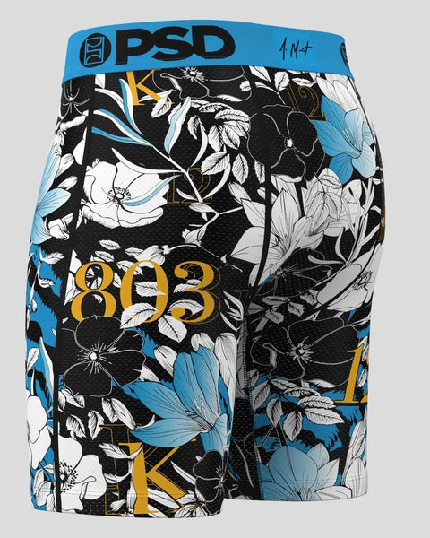 PSD boxer briefs with blue waistband, black and white floral pattern, and gold 