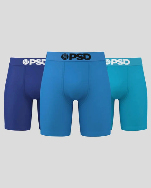 Three PSD boxer briefs in navy, royal blue, and teal with white waistband logos.