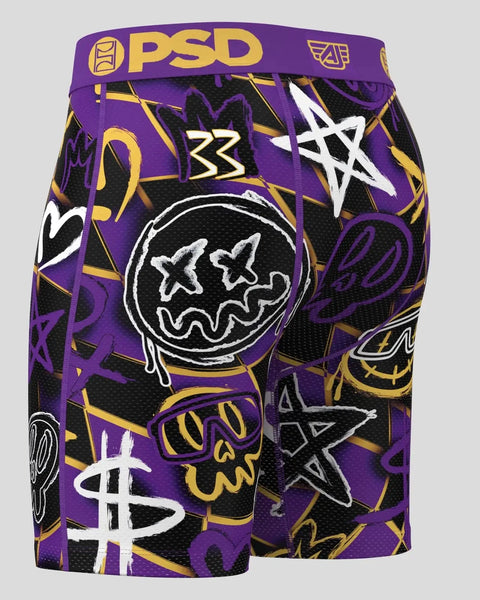 PSD boxer briefs with purple waistband featuring purple, black, and gold all-over graphic print with stars and icons.