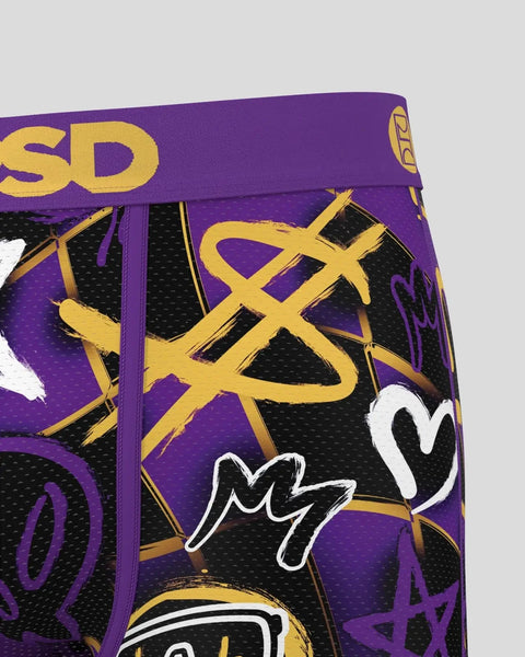 Purple and gold boxers with abstract yellow line designs, black mesh panels, and white graphic elements.