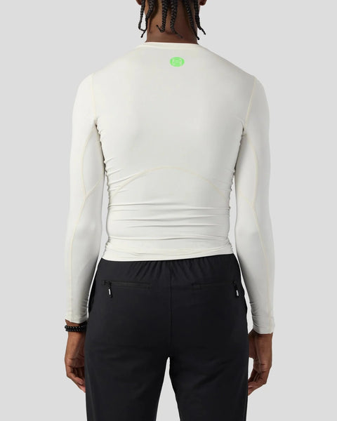 Ash long sleeve compression tee with fitted silhouette and small green logo on upper back.