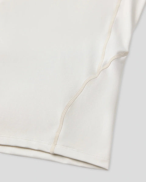 Ash-colored short sleeve compression tee with flat-lock seam stitching along the side.