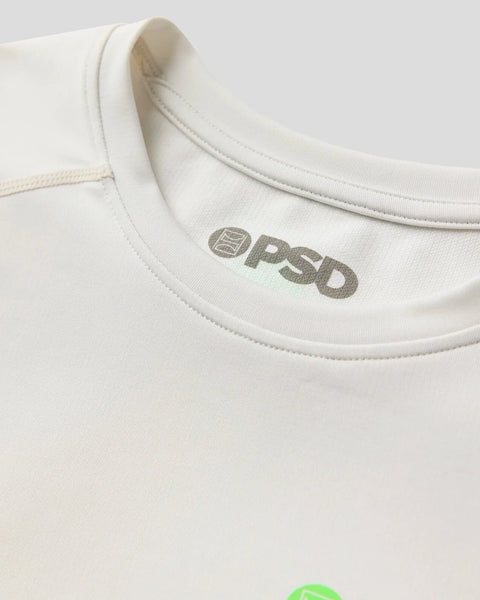 Cream-colored short sleeve compression tee with crew neckline and gray brand logo on chest.