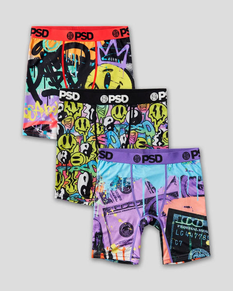 Three PSD boxer briefs with colorful graphic prints including smiley faces, abstract designs, and currency imagery.
