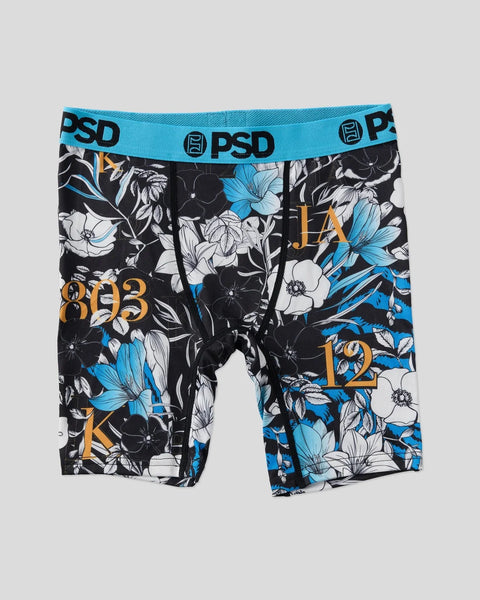 PSD boxer briefs with turquoise waistband, black base, and blue and white floral pattern with gold typography.