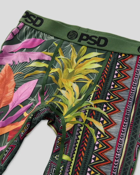 PSD brand underwear with green waistband featuring yellow sunflower, pink and orange tropical leaves, and geometric Aztec-ins