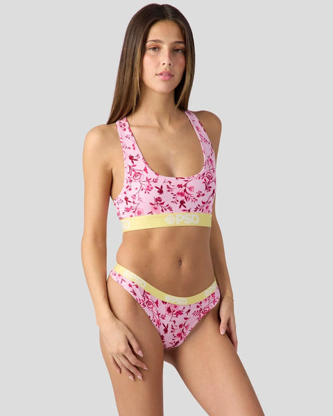 Pink floral bikini set with yellow trim and bunny motif pattern on racerback top and briefs.