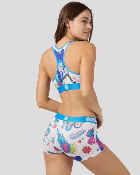 Woman wearing blue racerback sports bra and matching shorts with Rick and Morty character and colorful graphic prints.