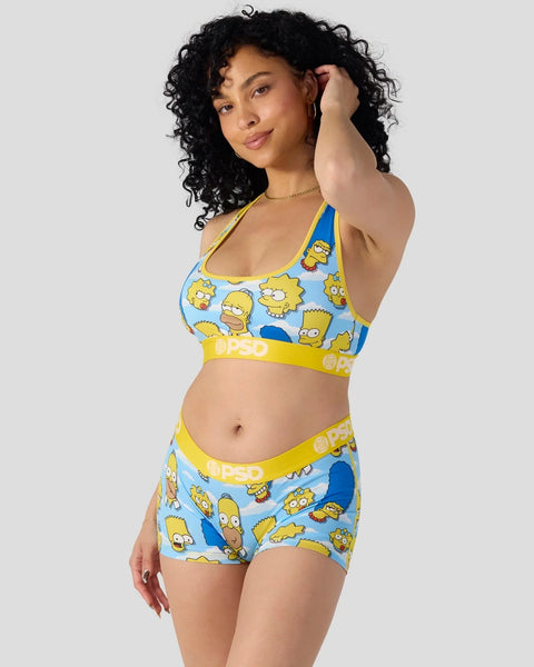Blue and yellow sports bra and shorts set with Simpsons character print and yellow OPSO branding.