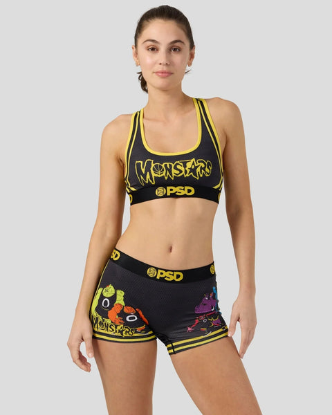 Black and yellow Monstars sports bra and shorts set with character graphics and PSD branding.