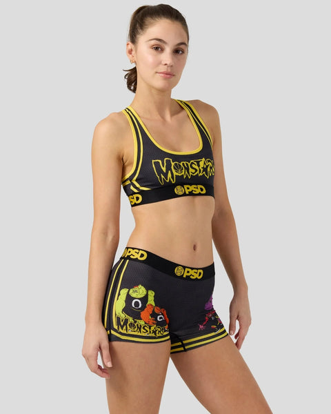 Black and yellow Monstars sports bra and shorts set with character graphics and PSD branding.