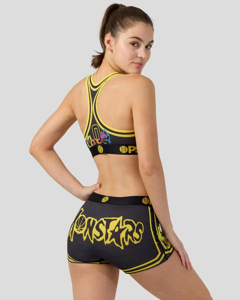 Black and yellow Monstars sports bra and shorts set with character graphics and yellow trim.