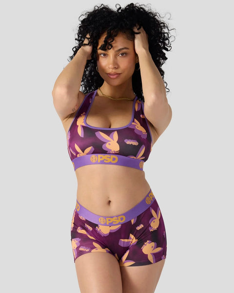 Purple sports bra and shorts set with yellow Playboy bunny print and PSD branding.
