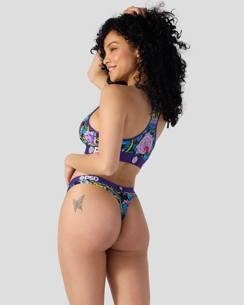 Purple bra and thong set with multicolored paisley and floral pattern.