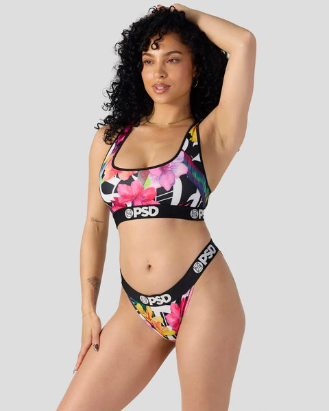 Black sports bra and briefs set with pink and yellow floral pattern and PSD branding on elastic bands.
