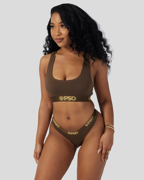 Brown racerback sports bra and matching briefs with gold logo waistband.