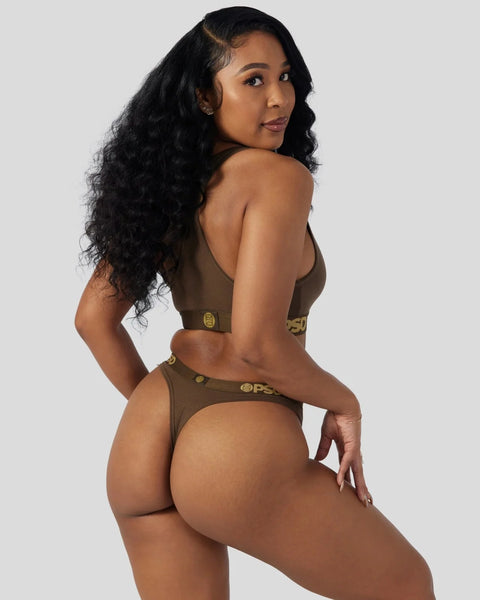 Woman wearing cocoa brown bralette and thong with logo details.