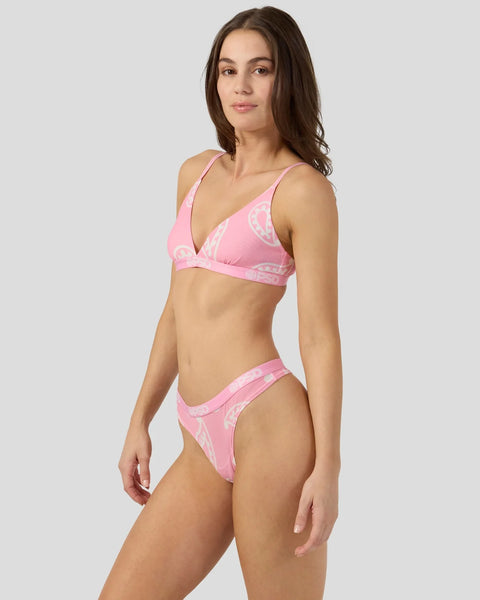 Pink mesh bandana print two-piece bikini with triangle top and bottom on model against neutral background.