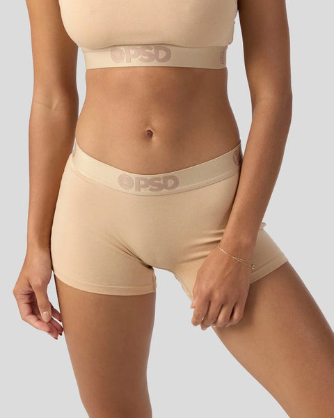 Beige modal crop top and shorts set with embroidered waistband on model.