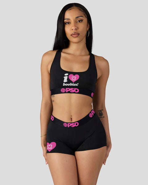 Black sports bra and shorts set with white and pink 
