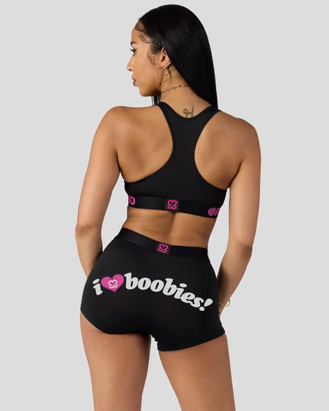Black sports bra and shorts set with pink heart logos and 