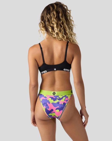 Black sports bra with spaghetti straps and colorful neon camouflage bikini bottom with lime green waistband, shown from back.