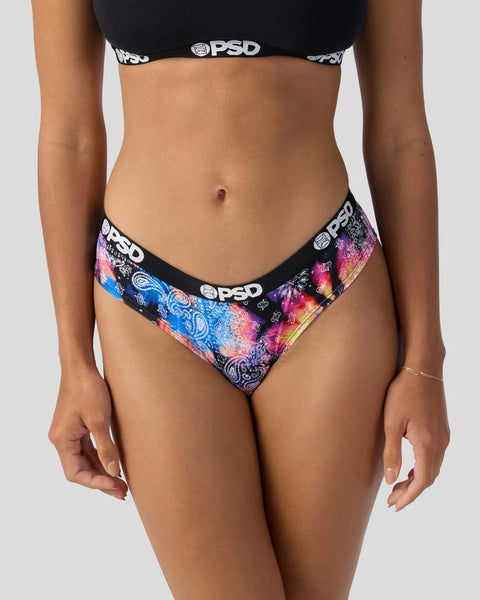 Person wearing black PSD sports bra and colorful patterned briefs with blue, pink, and purple design and PSD branding.